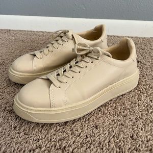 Woman’s tan Sneakers